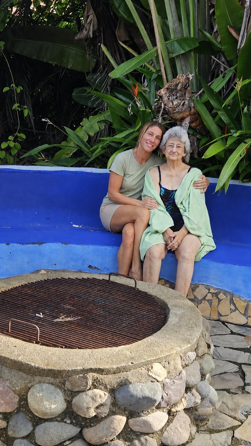 A caregiver and client together in the garden