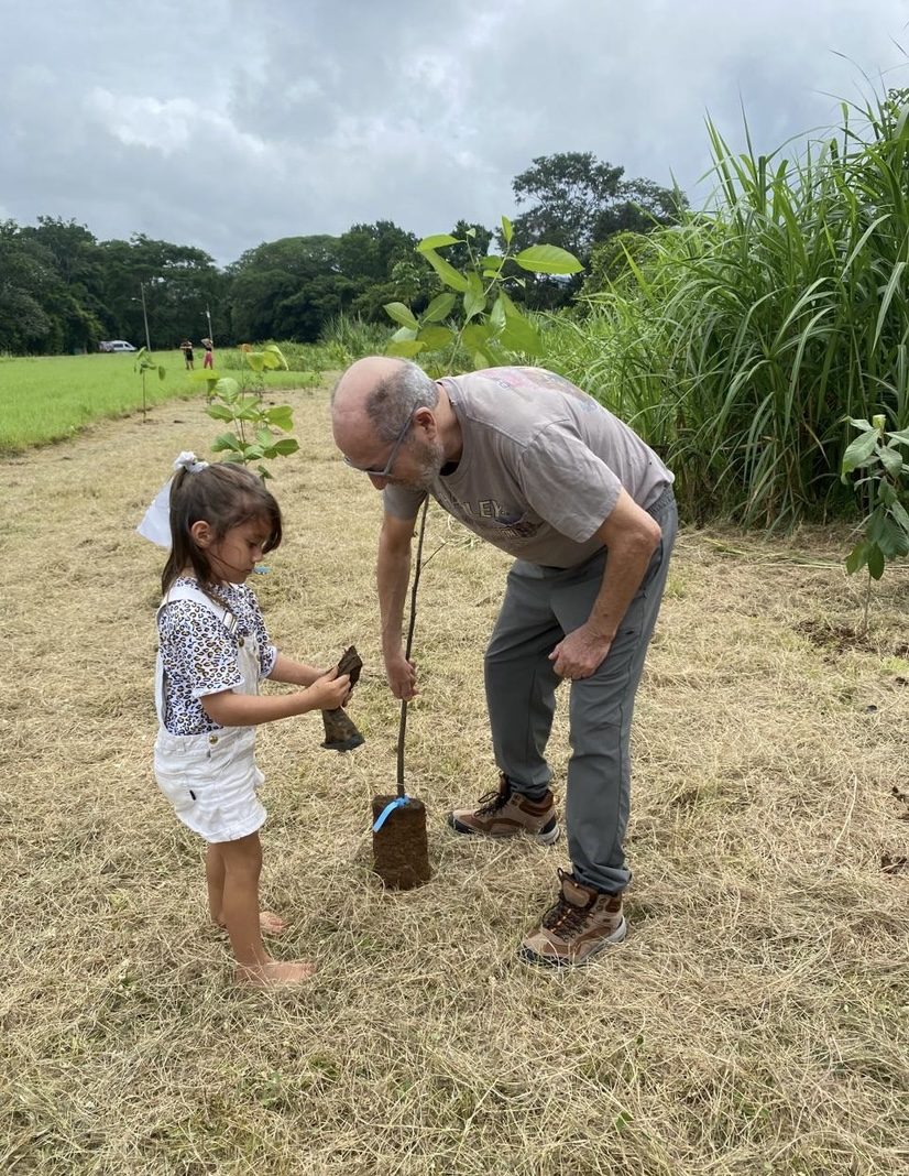 A grandfather and grandchild in the garden